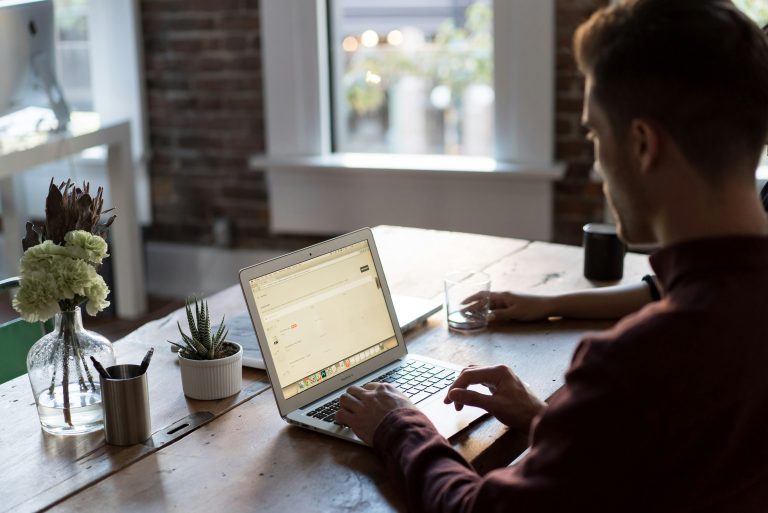 Reviewing an online store's product listings on a laptop